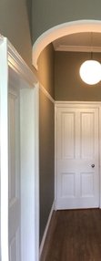 Painted hallways with bannisters and door frames